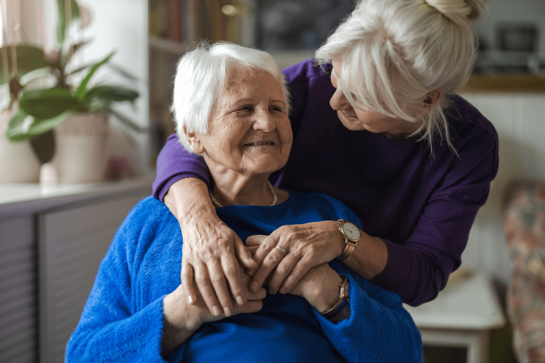 Carer supporting an older woman